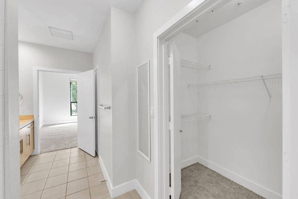 4605 Cedar Springs Road, #327, Dallas, TX 75219 Recessed closet with wire shelving and carpeted flooring