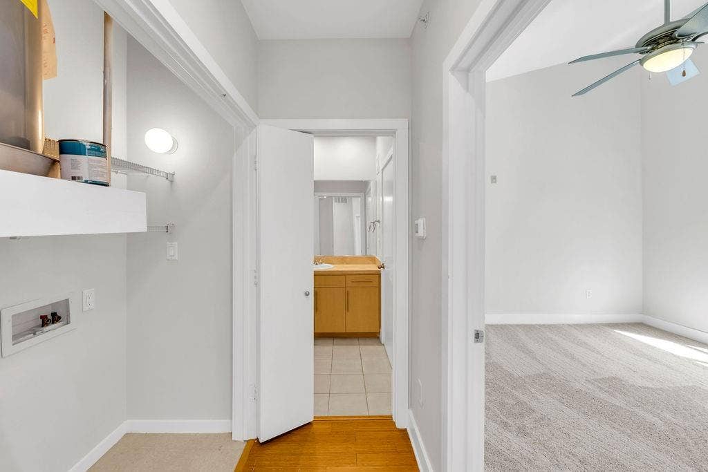 4605 Cedar Springs Road, #327, Dallas, TX 75219 Dedicated laundry area with wall-mounted lighting