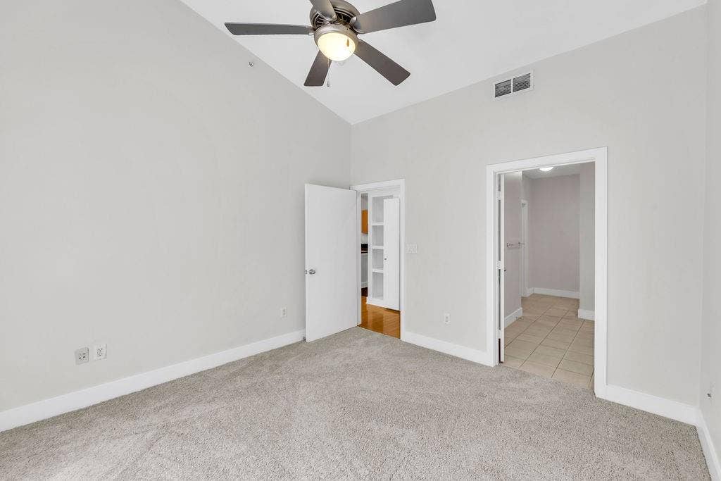 4605 Cedar Springs Road, #327, Dallas, TX 75219 Neutral wall tones, recessed lighting, ceiling fan, and carpeted flooring