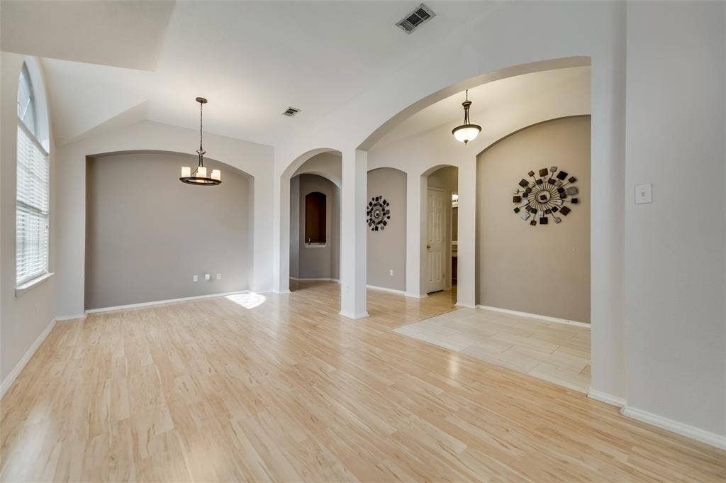 5100 Geranium Court, McKinney, TX 75070 Formal Dining and Living combined to provide a large space and an open feel with decorative lights