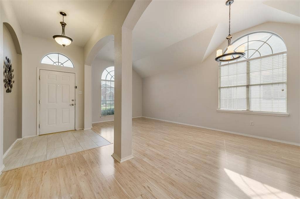 5100 Geranium Court, McKinney, TX 75070 Formal Dining and Living combined to provide a large space and an open feel with decorative lights