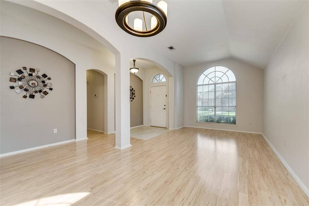 5100 Geranium Court, McKinney, TX 75070 Formal Dining and Living combined to provide a large space and an open feel with decorative lights