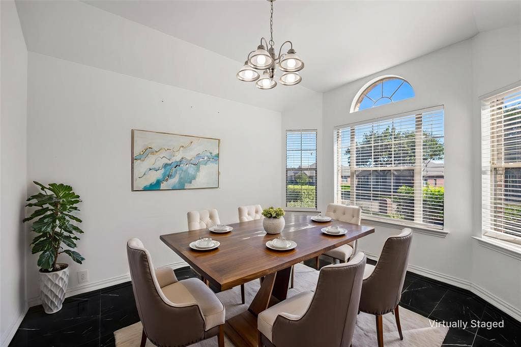 221 Cliffbrook Drive, Wylie, TX 75098 Bay window with an arched transom, sleek black tile flooring, and a modern chandelier