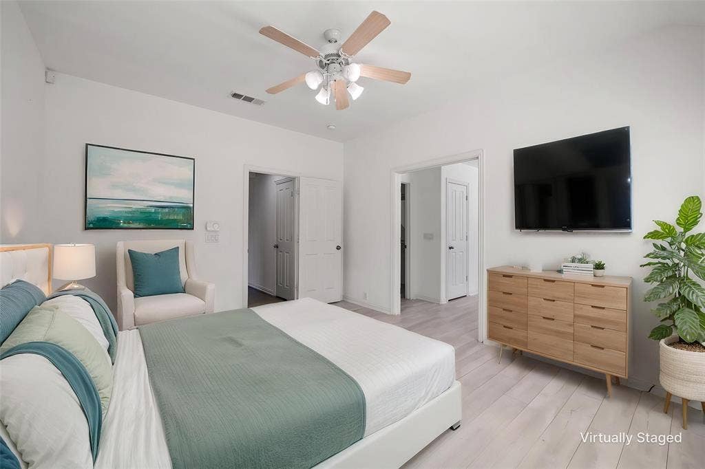 221 Cliffbrook Drive, Wylie, TX 75098 Light wood-finish flooring, ceiling fan with integrated lighting, and white interior doors