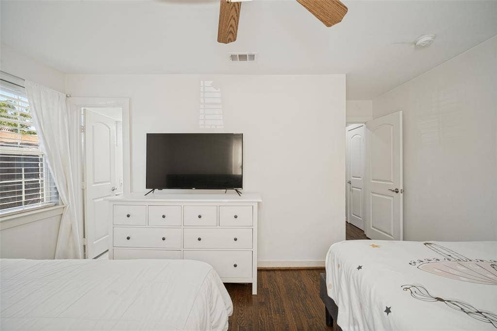 3209 Karla Drive, Mesquite, TX 75150 Wood-finish flooring with white trim, white walls, and a ceiling fan