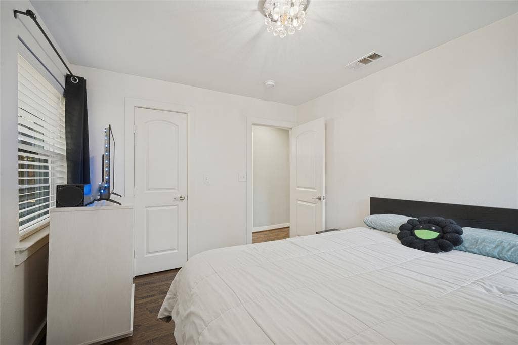 3209 Karla Drive, Mesquite, TX 75150 Recessed lighting, wood-finish flooring, white walls, and a crystal chandelier