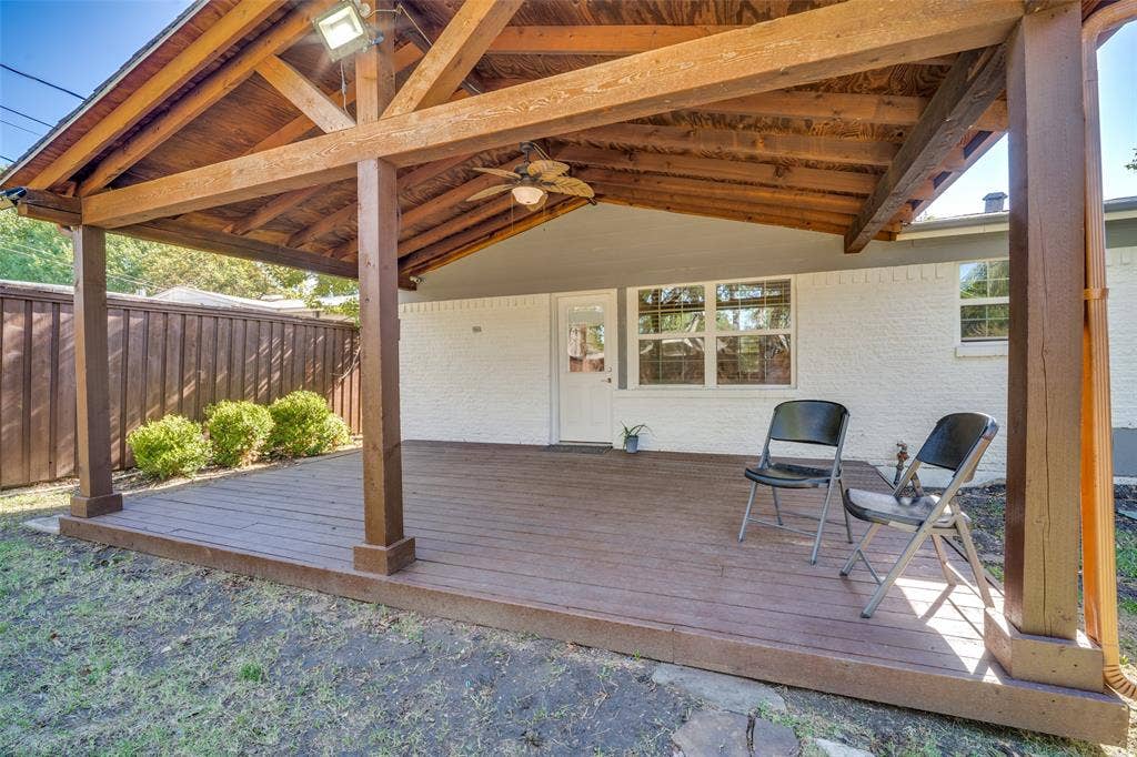 3209 Karla Drive, Mesquite, TX 75150 Expansive covered patio with exposed wood beams, composite decking, and a ceiling fan