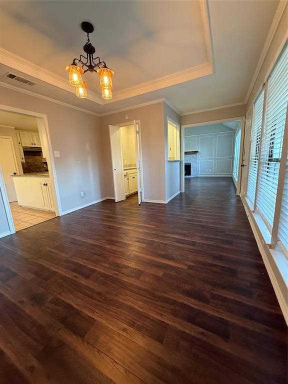 3407 Ruidoso Drive, Arlington, TX 76017 Wood-finish flooring throughout, featuring a tray ceiling with a decorative chandelier
