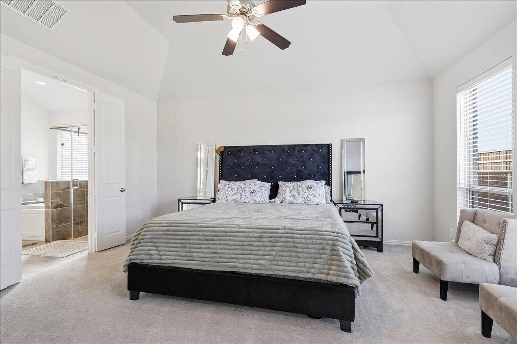 Vaulted ceiling with a ceiling fan, recessed lighting, and soft carpet flooring