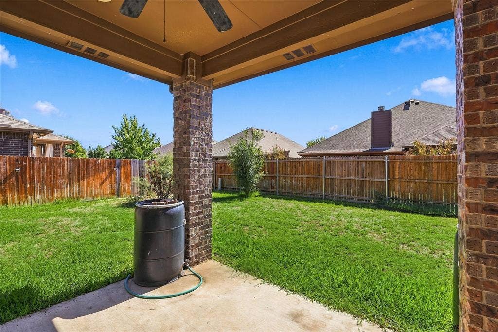4716 Kendrick Peak Way, Fort Worth, TX 76244 Covered patio with a ceiling fan, concrete flooring, and brick-clad support columns