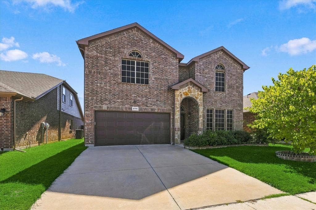 4716 Kendrick Peak Way, Fort Worth, TX 76244 Brick and stone facade with arched entry