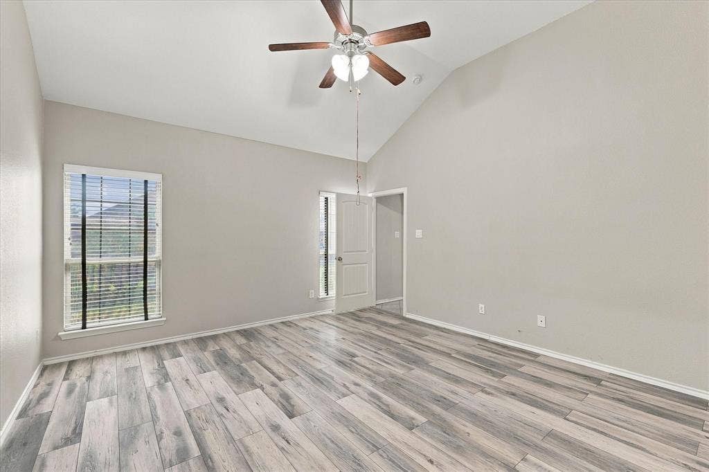 4716 Kendrick Peak Way, Fort Worth, TX 76244 Vaulted ceiling, wood-finish flooring, ceiling fan, and window with blinds