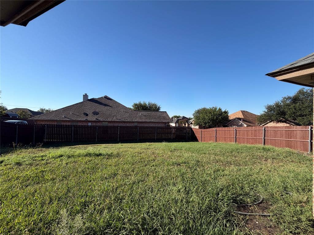 5932 Highcrest Drive, Watauga, TX 76148 Expansive backyard with a full perimeter fence and established ground cover