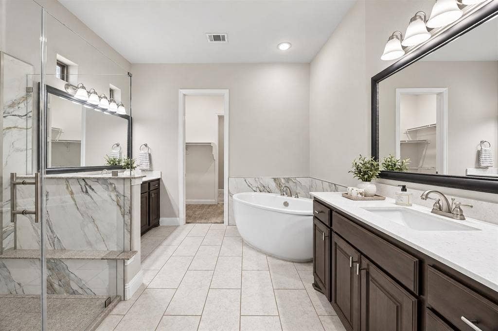 1536 Sonnet Drive, Heath, TX 75126 Primary Bath with dual vanities and separate shower.