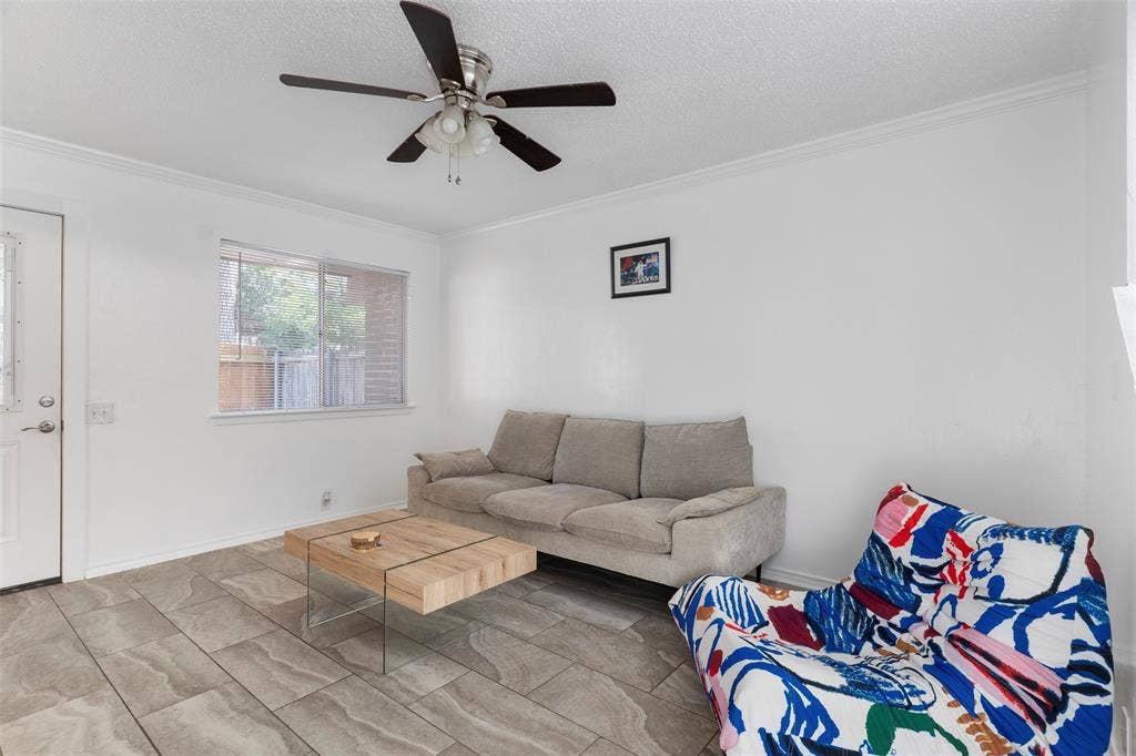 4414 Westminster Drive, Irving, TX 75038 Recessed window, crown molding, ceiling fan, and tile flooring