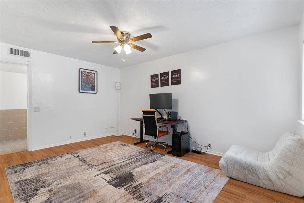 4414 Westminster Drive, Irving, TX 75038 Wood-finish flooring with a ceiling fan overhead