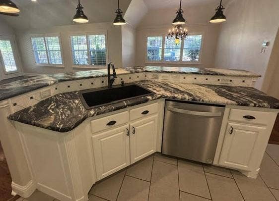 1900 Hackett Creek Drive, McKinney, TX 75072 central kitchen sink and counters that opens to a living area