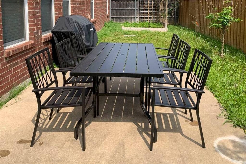 1950 Garrison Way, Garland, TX 75040 Concrete patio area with a brick exterior and a privacy fence