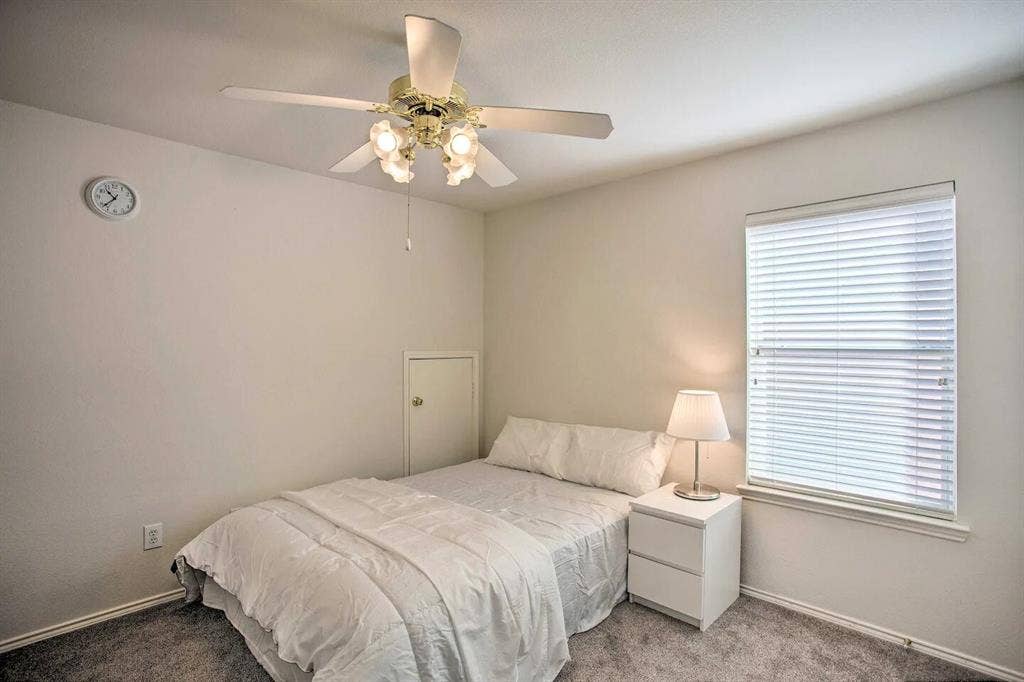 1950 Garrison Way, Garland, TX 75040 Recessed window with white blinds, wall-to-wall carpeting, and a ceiling fan with integrated lighting