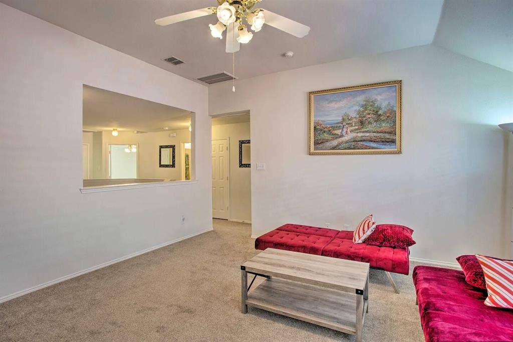 1950 Garrison Way, Garland, TX 75040 Vaulted ceiling, ceiling fan with integrated lighting, neutral carpet flooring, and a pass-through window opening