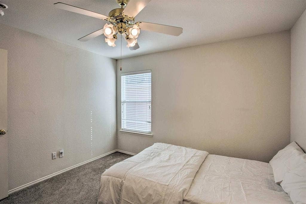 1950 Garrison Way, Garland, TX 75040 Recessed window with blinds, ceiling fan with integrated lighting, and carpeted flooring