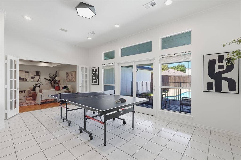 White tile flooring throughout, recessed lighting, and a contemporary ceiling fixture