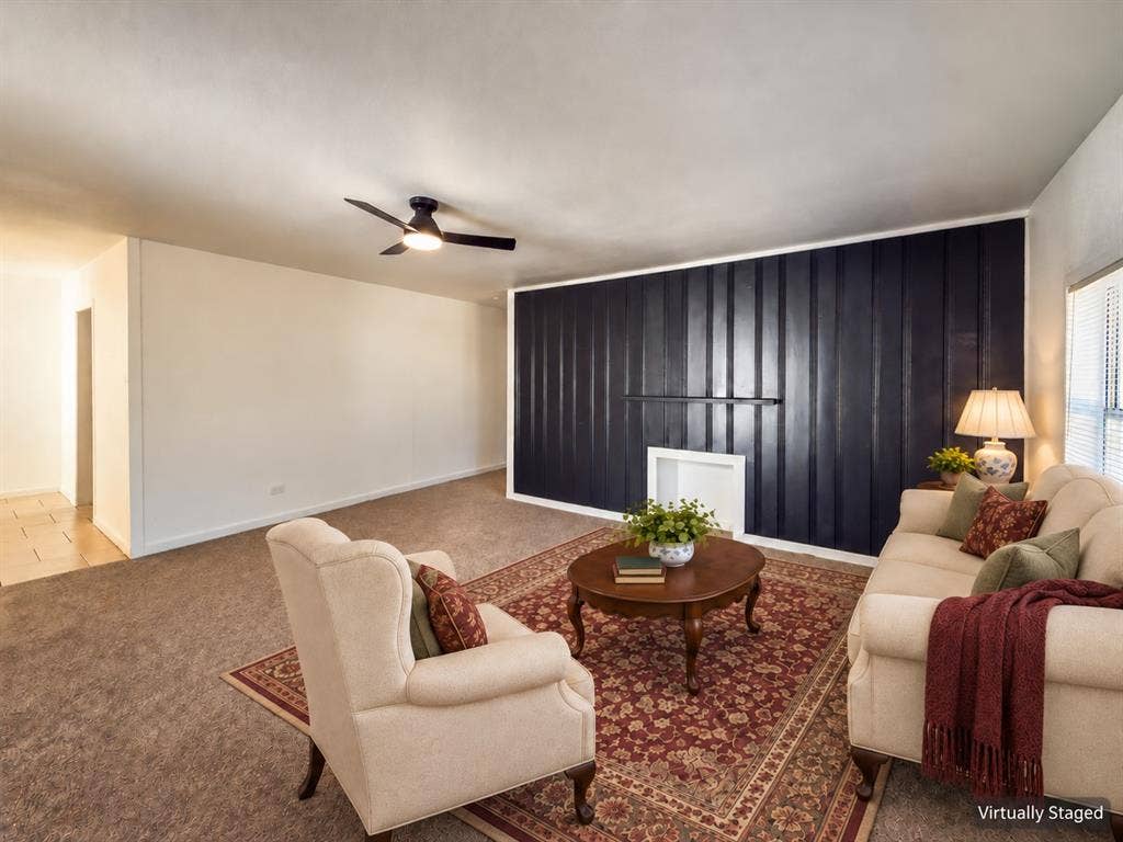 3709 N 22nd Street, Waco, TX 76708 Recessed wall feature with dark paneling, overhead ceiling fan, and light-toned carpeting