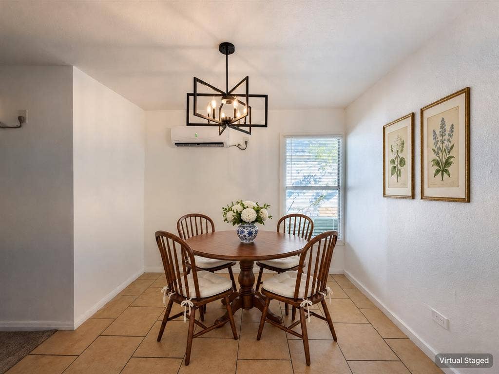 3709 N 22nd Street, Waco, TX 76708 Tile flooring, wall-mounted air conditioning unit, rectangular window, and a geometric chandelier