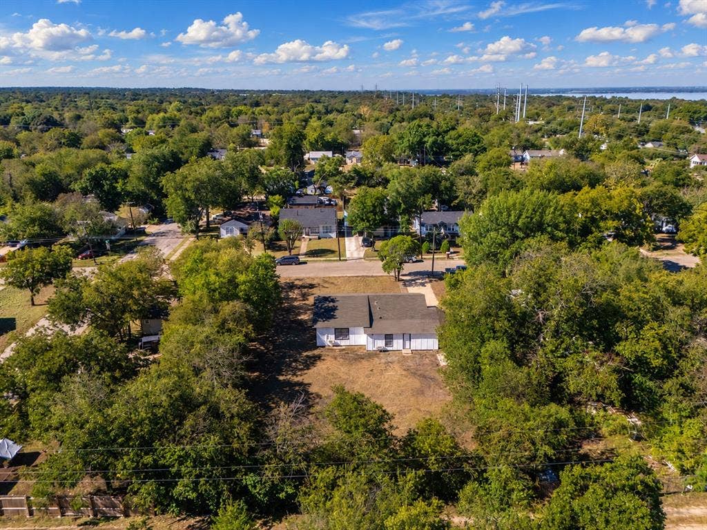 3709 N 22nd Street, Waco, TX 76708 Aerial perspective showcasing a residential lot with mature trees, surrounded by established neighborhood homes