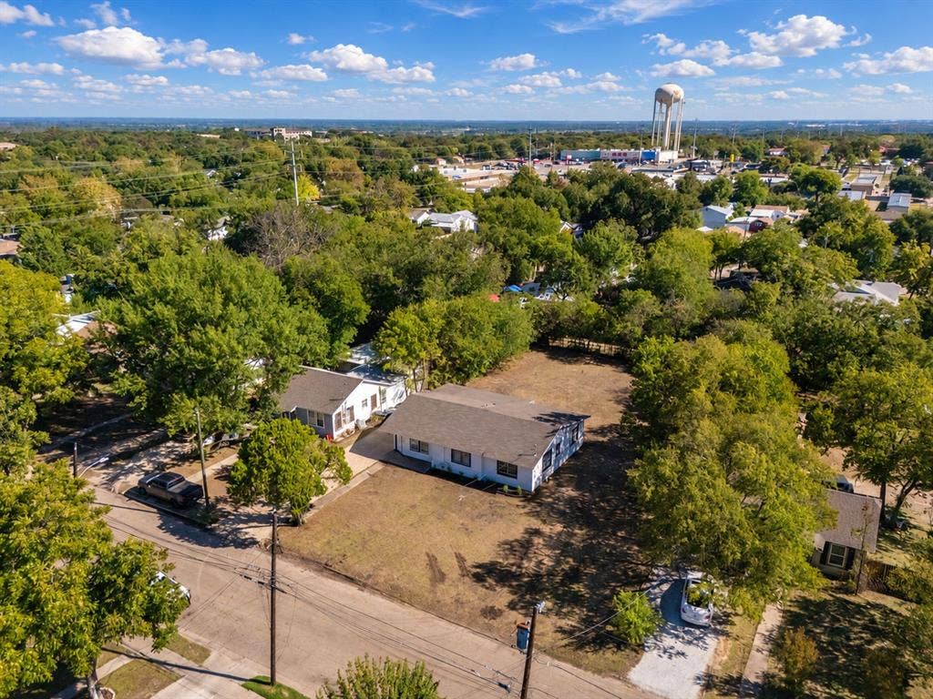 3709 N 22nd Street, Waco, TX 76708 Property with a white exterior and a dark roof, situated on a substantial parcel of land