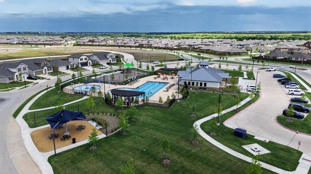 4562 Riverbank Road, Crandall, TX 75114 Community amenities featuring a swimming pool, clubhouse, playground, and manicured green spaces