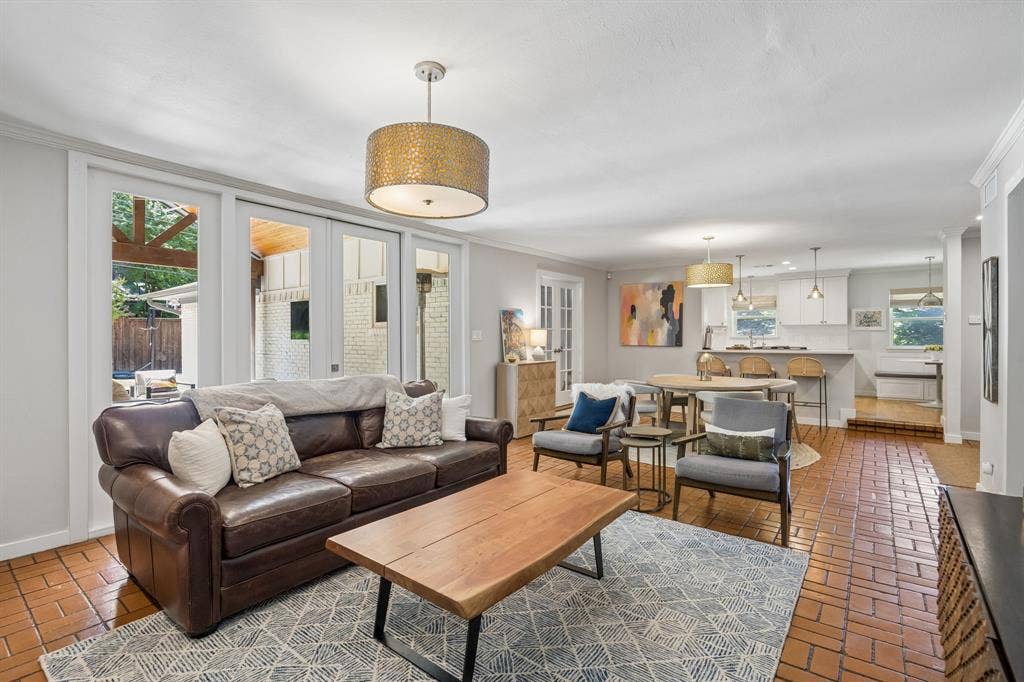 10428 Vinemont, Dallas, TX 75218 Brick-finish flooring, white wall paint, and recessed lighting