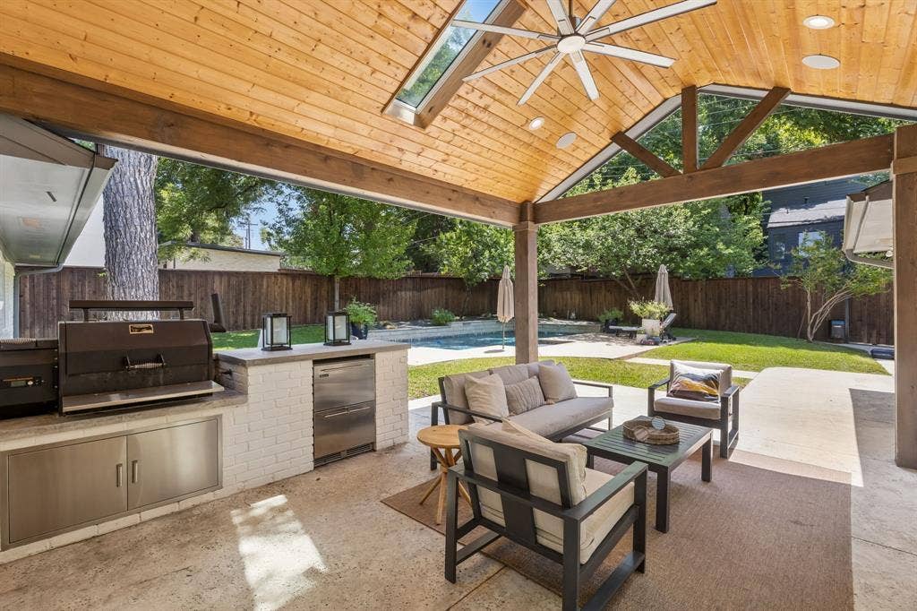 10428 Vinemont, Dallas, TX 75218 Covered patio featuring a wood-finish vaulted ceiling, recessed lighting, and a ceiling fan