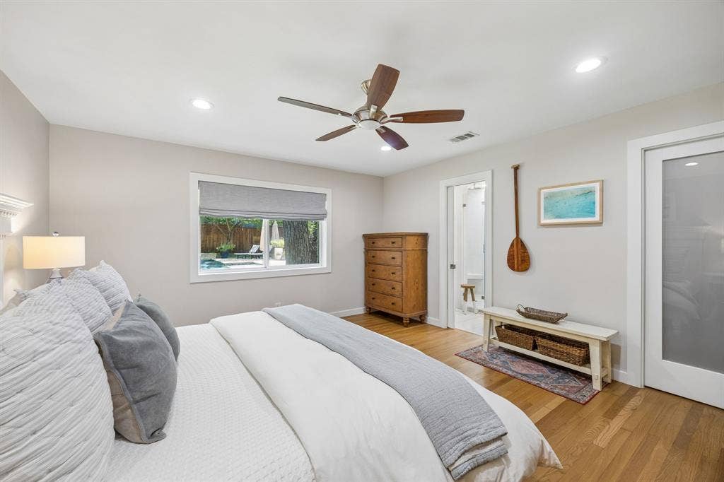 10428 Vinemont, Dallas, TX 75218 Wood-finish flooring, recessed lighting, wood ceiling fan, window with exterior pool visibility, and a frosted glass panel door