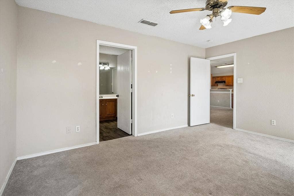 Neutral-toned walls and carpeting