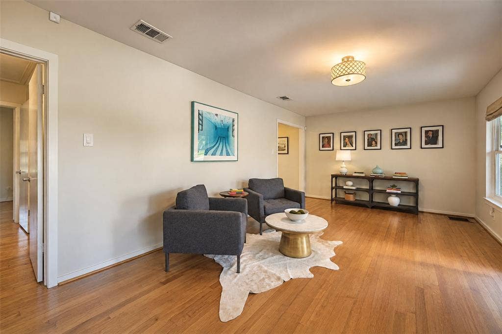 6866 Burwood Lane, Dallas, TX 75214 Hardwood flooring throughout, recessed lighting, and a window with roller shade
