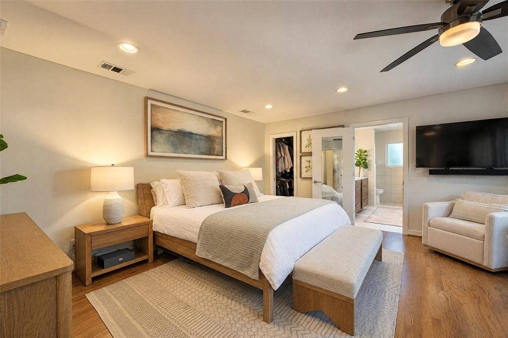 6866 Burwood Lane, Dallas, TX 75214 Recessed ceiling lighting, wood-finish flooring, a ceiling fan with integrated lighting, and a closet with bifold mirrored doors