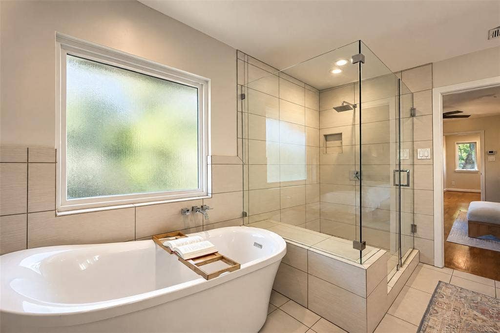 6866 Burwood Lane, Dallas, TX 75214 Freestanding soaking tub with wall-mounted fixtures