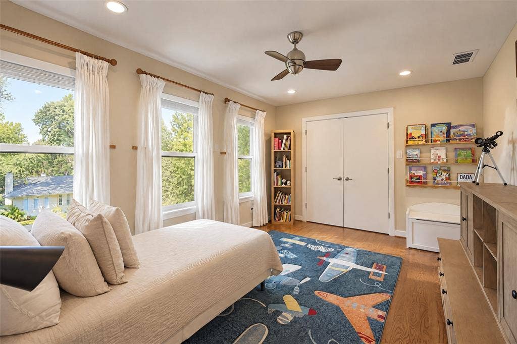6866 Burwood Lane, Dallas, TX 75214 Hardwood flooring and recessed lighting illuminate the room