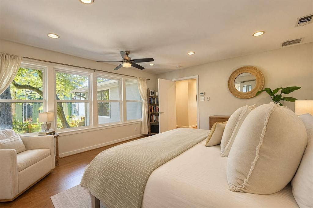 6866 Burwood Lane, Dallas, TX 75214 Recessed lighting, wood-finish flooring, ceiling fan, and multiple windows