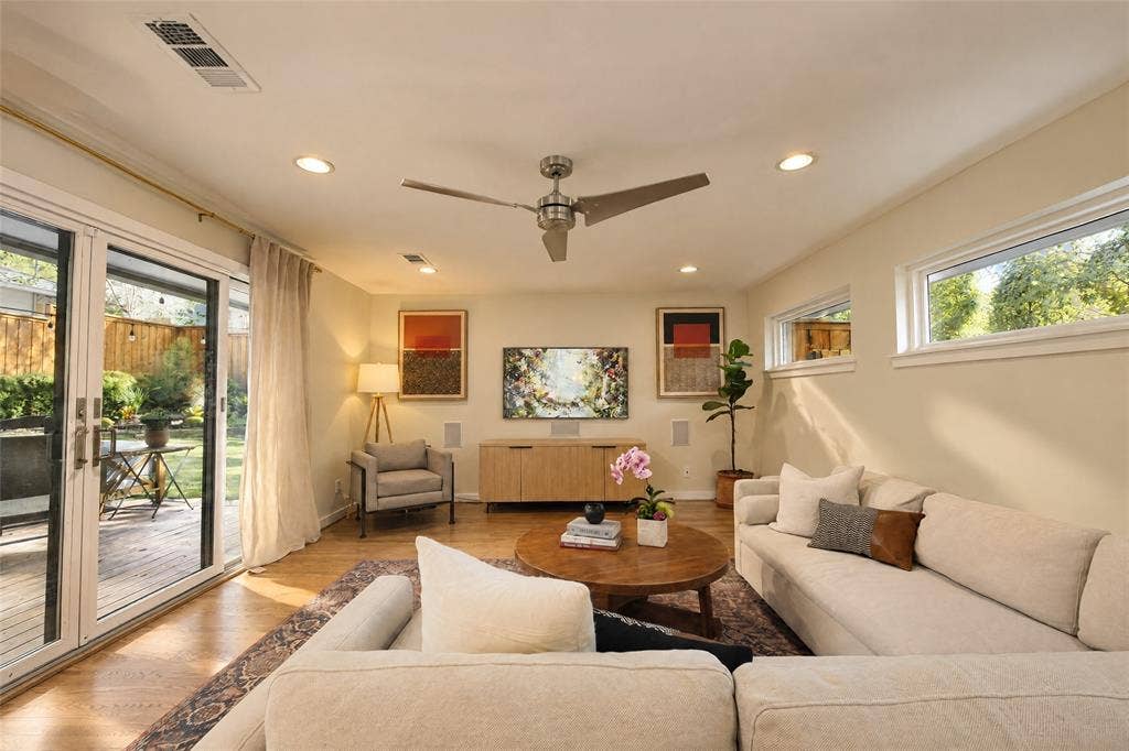 6866 Burwood Lane, Dallas, TX 75214 Wood-finish flooring with recessed lighting and a ceiling fan