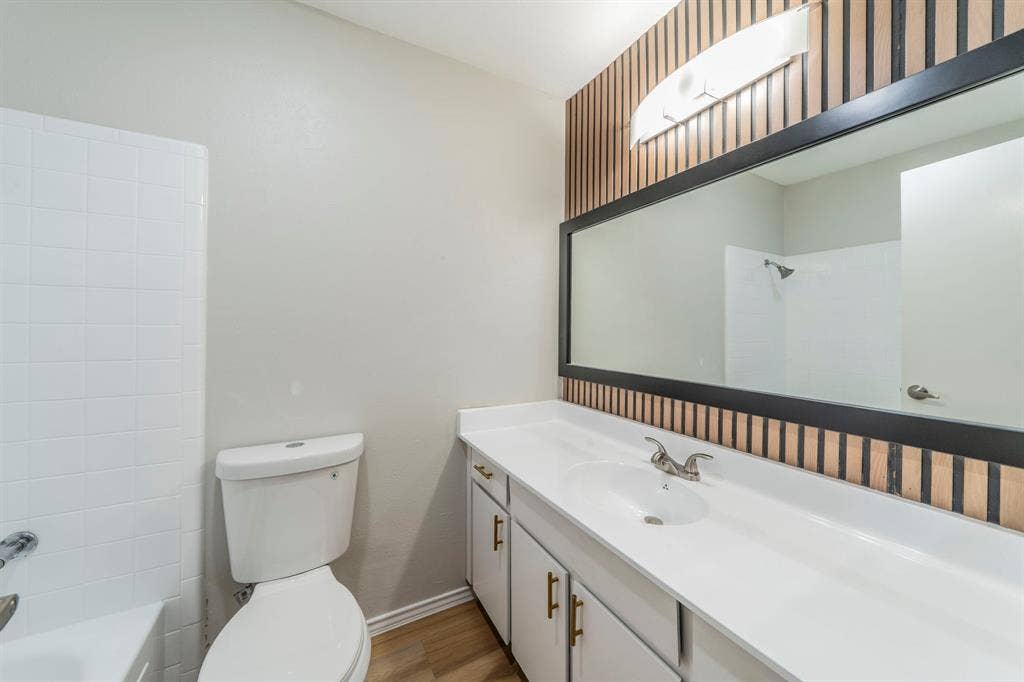 802 Birchwood Drive, Garland, TX 75043 White tile tub and shower combination
