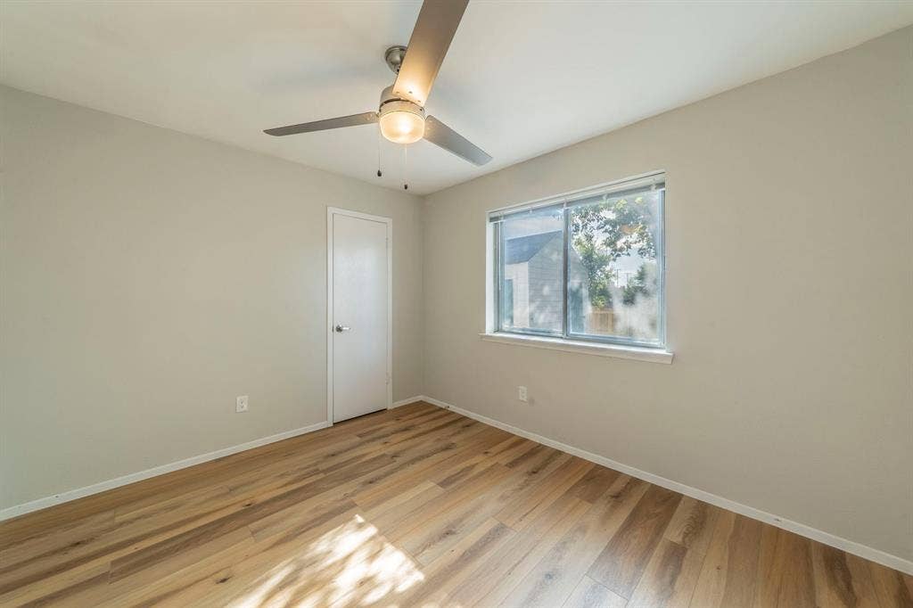 802 Birchwood Drive, Garland, TX 75043 Wood-finish flooring with neutral wall tones