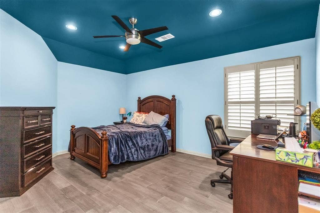 1838 Olney Drive, Allen, TX 75013 Tray ceiling with recessed lighting, ceiling fan, wood-finish flooring, and window with plantation shutters