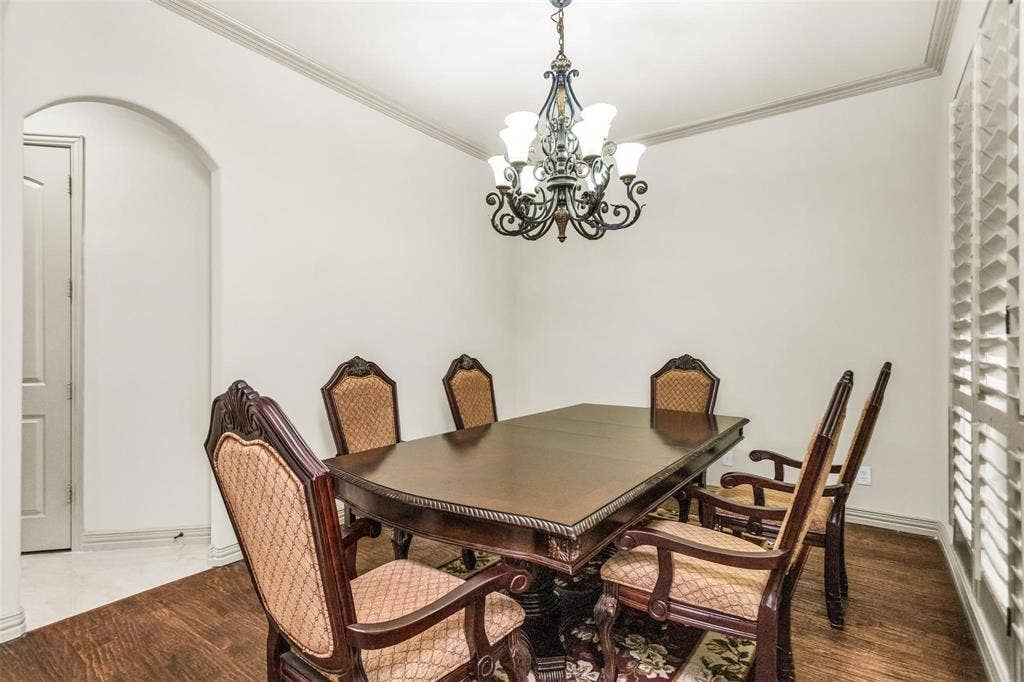 1838 Olney Drive, Allen, TX 75013 Wood-finish flooring, crown molding, and an arched doorway