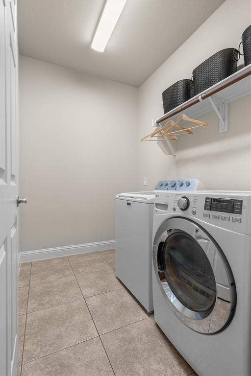 Convenient laundry room with washer and dryer included, plus shelf storage