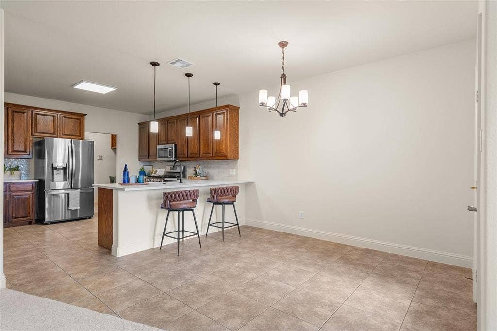Kitchen with bar seating overlooking the living area — perfect for entertaining