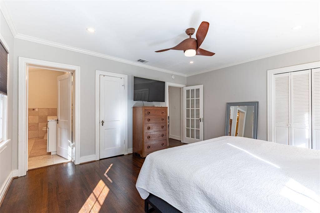 Two separate closets provide storage and there's still plenty of room for a second dresser.