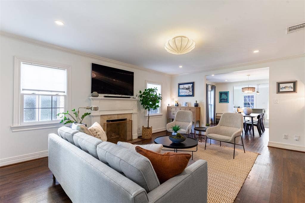 Step into the living room which is anchored by the  fireplace.