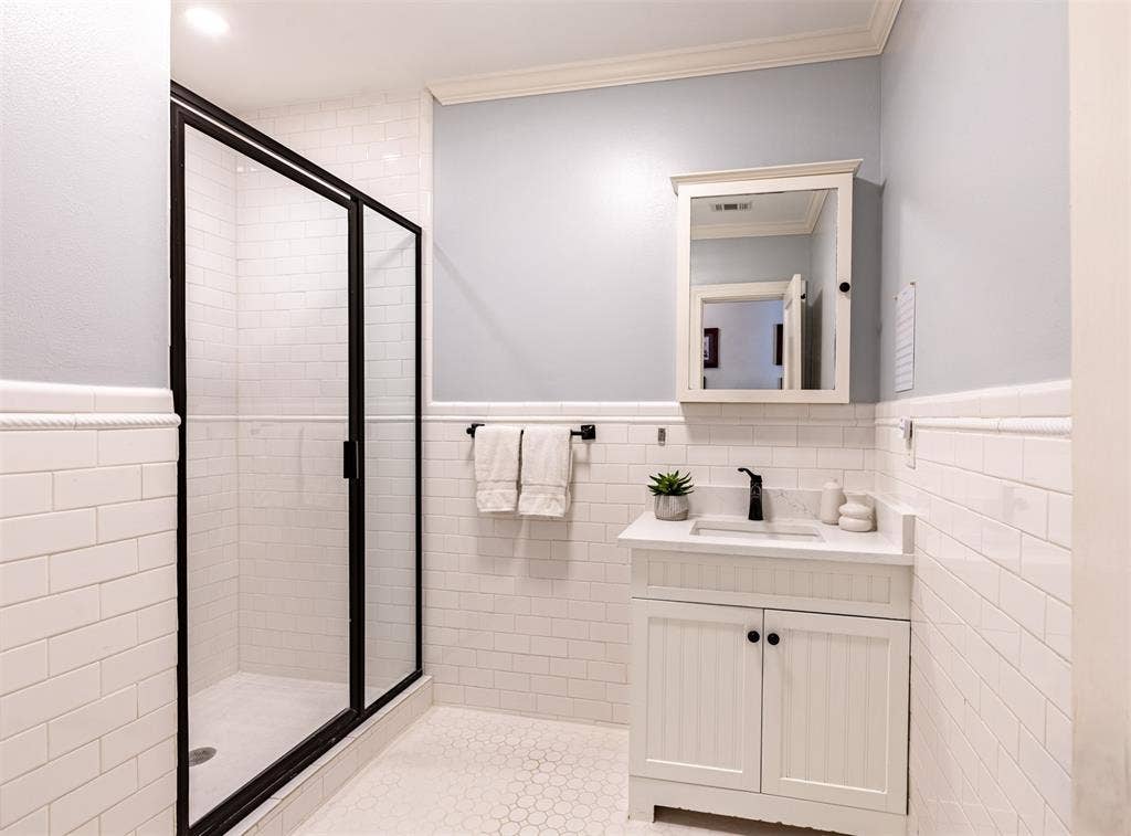 The hallway bath with it full-sized shower serves the front bedroom as well as guests.
